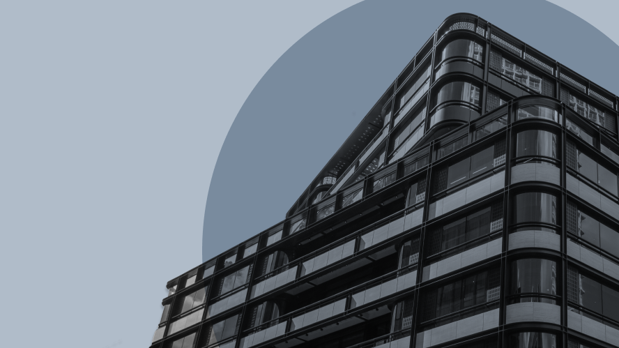 Low-angle view of a modern glass office building with curved edges and layered balconies, set against a muted blue circular graphic background. The image conveys scale, structure, and contemporary architecture without people or signage visible.